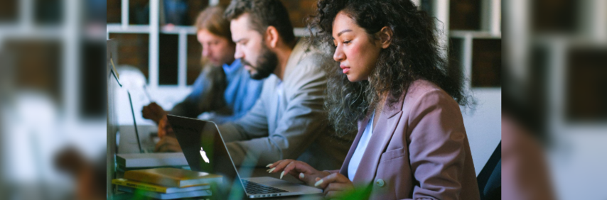employees looking at laptops