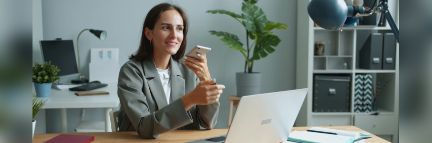 employee using laptop and phone